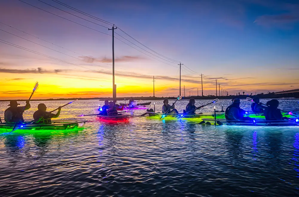 people rowing in a kayak