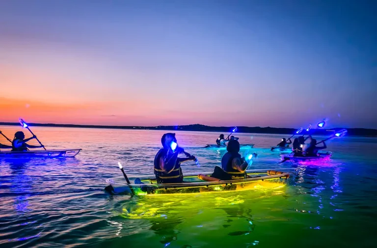 header-image people in a glowing kayak